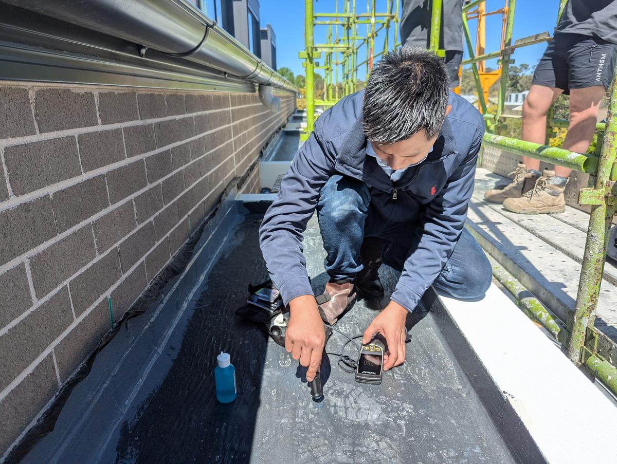 Engineer conducting forensic building investigation
